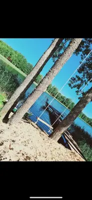 a boat sitting in the sand near the water at Čičirio krantas in Vėdariai