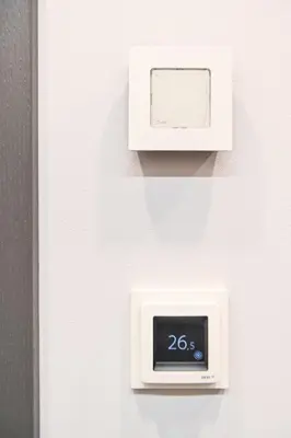 a clock on a wall with a thermometer on it at Modern I Penthouse Apt w - AC I Cohost in Vilnius