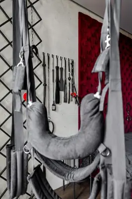 a bunch of tools hanging on a wall at 69 Fetish Apartments with Free Underground Parking in Kaunas