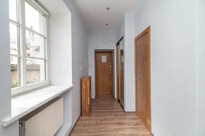 a hallway with a door and a window at Old Town Peace Haven in Vilnius