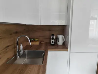 a kitchen with a sink and a counter top at Stay Rokiškis apartments in Rokiškis