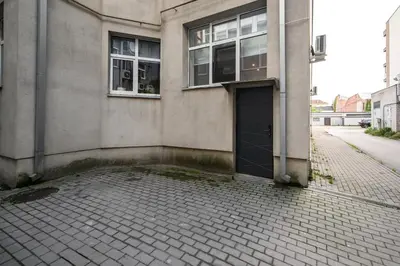 a building with a door on the side of a street at D-loft in Kaunas