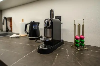 a kitchen counter top with a hair dryer and balls at D-loft in Kaunas