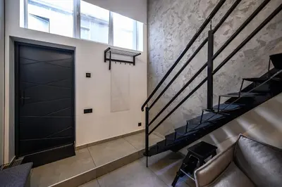 a staircase leading up to a door in a building at D-loft in Kaunas