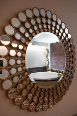 a mirror reflecting a bathroom with a bath tub at SPA apartments in city centre in Vilnius