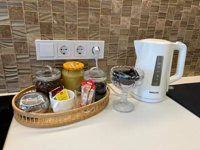 a kitchen counter with a tray of food and a blender at Skaidiškės Guesthouse in Skaidiškės