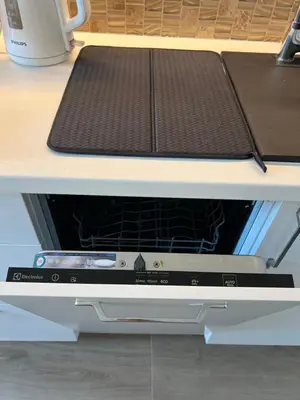 a microwave oven sitting on top of a table at Skaidiškės Guesthouse in Skaidiškės