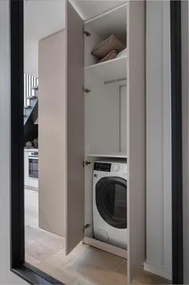 a laundry room with a washing machine and a mirror at Brand New Loft 61 in Pakopi