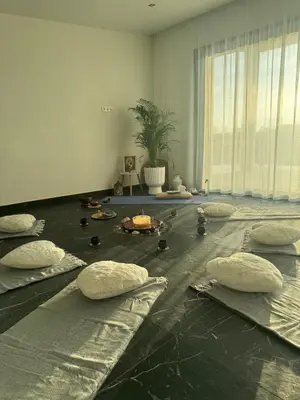 a room with pillows on the floor with a plant at Harmony Resort & Spa in Padumble