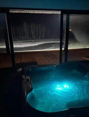 a bath tub in a room with a view of a street at Harmony Resort & Spa in Padumble