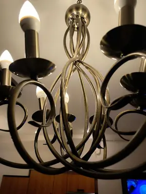 a metal chandelier hanging from a ceiling at Best location Old Town Choise in Vilnius