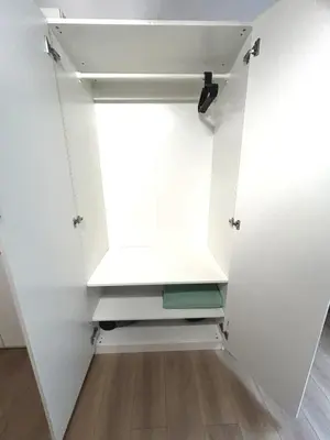 a small closet with a door with a window at Riverside Vilnius in Vilnius
