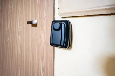 a close up of a door with a black handle at Urban escape Kaunas - One bedroom apartment Krėvės 16 in Kaunas