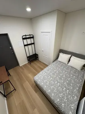 a small bedroom with a bed and a tv at 12 New Airport Apartment in Pakopi