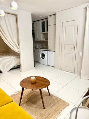 a living room with a couch and a table at Charming City-Center Apt I ᴄohost in Vilnius