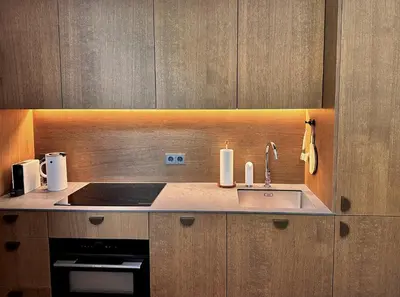 a kitchen with a sink and a stove at Old Town Whispers in Kaunas