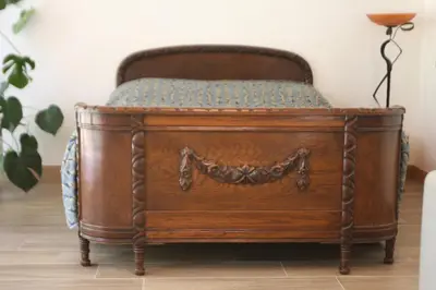 a wooden bed in a room with at Kernavės Pajauta in Kernavė