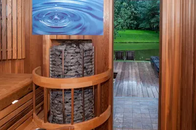 a view from the inside of a room with a pool of water at Kernavės Pajauta in Kernavė