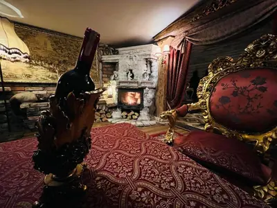 a bedroom with a bed with a wine bottle on it at Apartment Host 4 in Kaunas