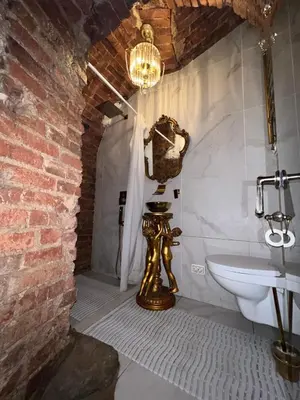 a bathroom with a sink and a mirror on the wall at Host 1 apartment in Kaunas