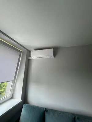 a room with a couch and a window at Apartamentai 1 in Raseiniai