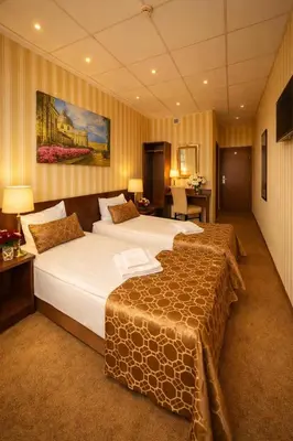 a hotel room with two beds in a room at Naujamiescio Studio 307 in Vilnius