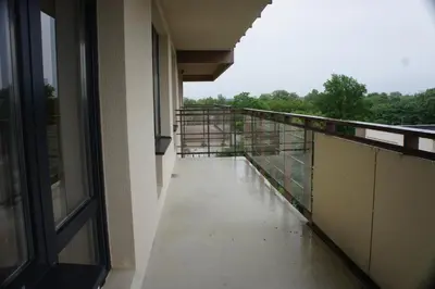 a view of a balcony with water on the floor at Lyra Apartments in Druskininkai