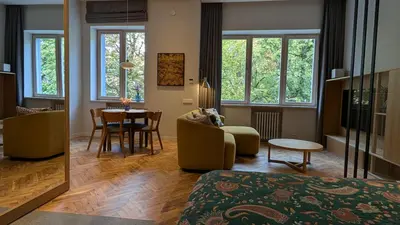 a living room with a couch and a table at Avenue Apartments in Kaunas