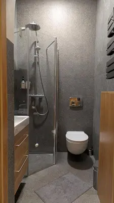 a bathroom with a shower with a toilet and a sink at Avenue Apartments in Kaunas