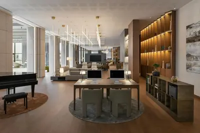 a living room with a table and a piano at AC Hotel by Marriott Vilnius in Vilnius