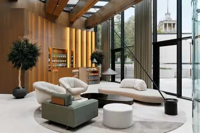 a lobby with two chairs and a couch and a table at AC Hotel by Marriott Vilnius in Vilnius