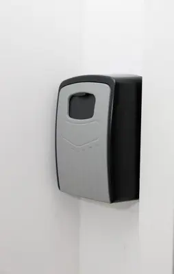 a black and white object on a white wall at Griunvaldo apartamentai in Kaunas