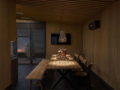 a dining room with a wooden table and chairs at Vilkiškių Karpis Glamping in Vilionys