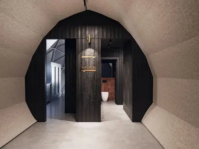 a hallway with an archway with a door in a room at Vilkiškių Karpis Glamping in Vilionys