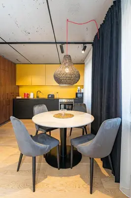 a dining room with a table and chairs at 2-BD Apartment Winery by Polo Apartments in Kaunas