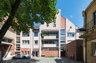 a car parked in front of an apartment building at 2-BD Apartment Winery by Polo Apartments in Kaunas