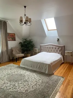 a bedroom with a bed and a rug and a window at Privatus Apartamentai Akademijoje in Akademija