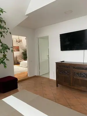 a living room with a flat screen tv on a wall at Privatus Apartamentai Akademijoje in Akademija