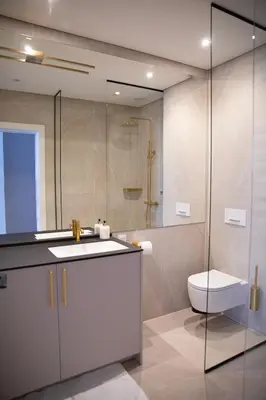 a bathroom with a sink and a toilet and a shower at Brand new luxurious apartment in Vilnius center in Vilnius