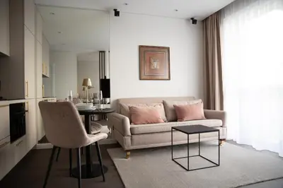 a living room with a couch and a table at Brand new luxurious apartment in Vilnius center in Vilnius