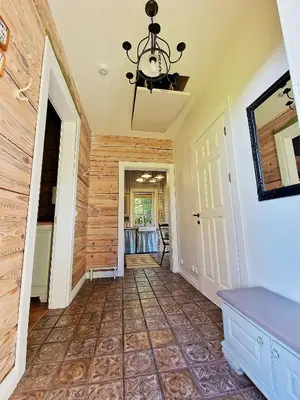 a hallway of a home with a chandelier at Provance style villa in regional park! in Šilėnai