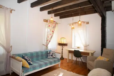 a living room with a couch and a table at Provance style villa in regional park! in Šilėnai