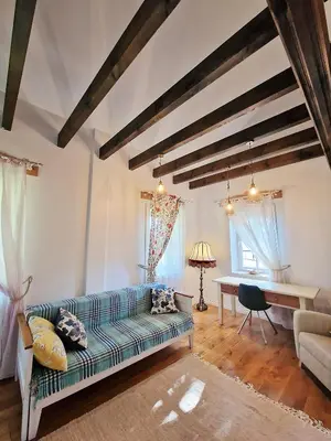a living room with a couch and a table at Provance style villa in regional park! in Šilėnai