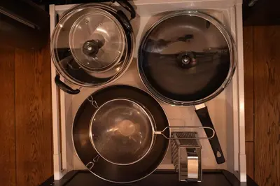 a group of three pots and pans in a wall at Steponas Old Town Studio in Vilnius