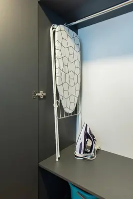 a towel rack on a shelf in a room at Castle Street Modern Apartments I cohost in Vilnius