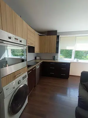 a kitchen with a washing machine in a kitchen at Julia's Apartment