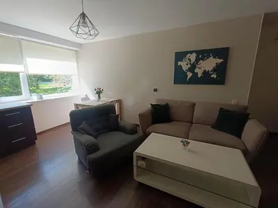 a living room with a couch and a coffee table at Julia's Apartment