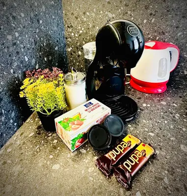 a pile of candy andocolates on the ground next to a blender at M&M Apartment III SELF CHECK-IN in Panevėžys