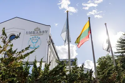 a group of flags in front of a building at Embassy Studio 303 in Vilnius