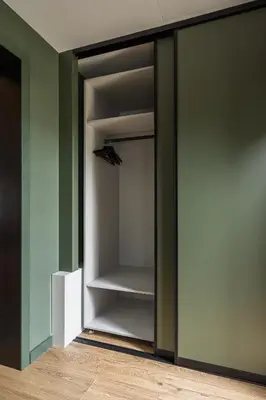 a walk in closet with a glass door at Sapnų cechas in Merkinė